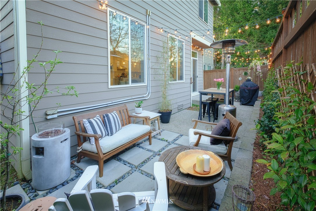 21807 38th Drive Southeast Bothell, WA 98021 - Photo 27 of 30 a view of a patio with couches table and chairs and potted plants