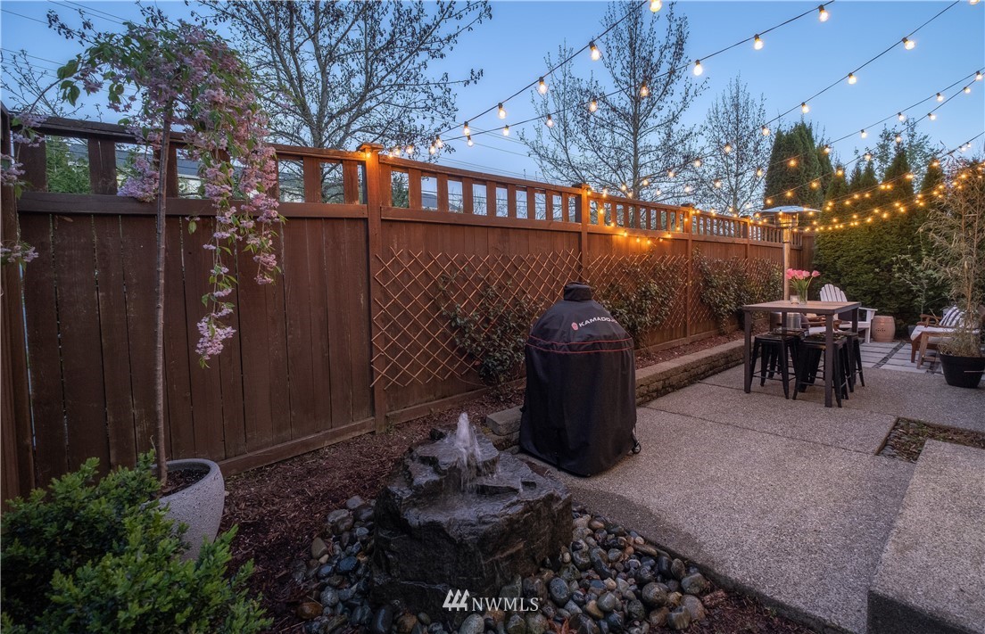 21807 38th Drive Southeast Bothell, WA 98021 - Photo 30 of 30 a view of a patio with couches table and chairs and potted plants