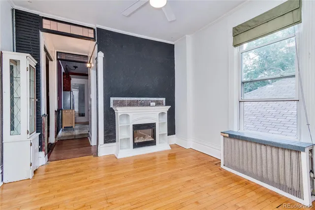 a bedroom with a bed and a fireplace