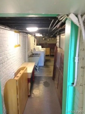 a view of a kitchen with furniture and a window