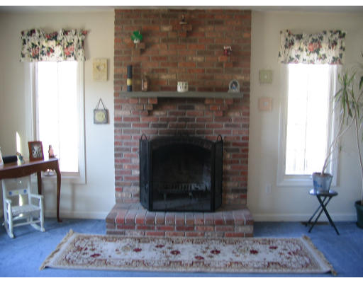54 Groton Road Shirley, MA 01464 - Photo 3 of 18 a living room with furniture and a fireplace