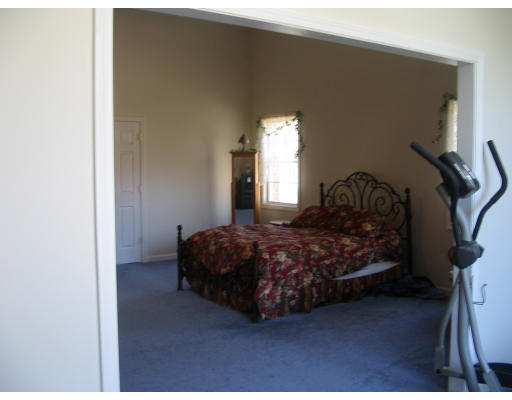 54 Groton Road Shirley, MA 01464 - Photo 8 of 18 a bedroom with a bed lamp and a potted plant
