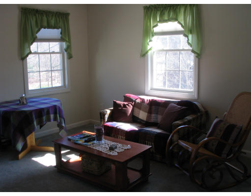 54 Groton Road Shirley, MA 01464 - Photo 9 of 18 a living room with furniture and a window