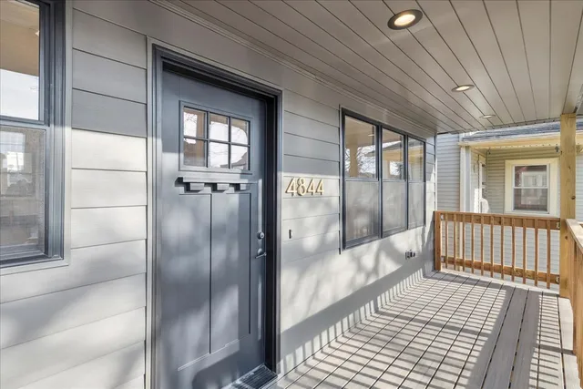 a view of a bathroom with a glass door