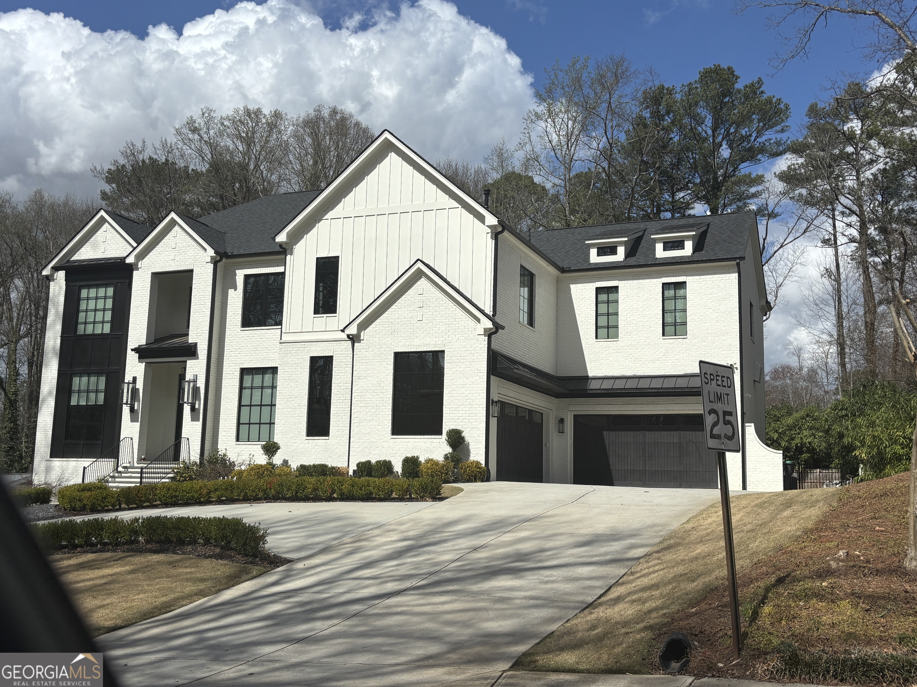 0 Hamby Road Acworth, GA 30102 - Photo 7 of 8 a front view of a house with a yard and garage