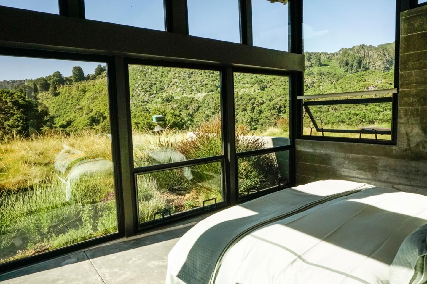 1 Goodrich Trail Carmel, CA 93923 - Photo 25 of 50 a bedroom with a bed and a large window