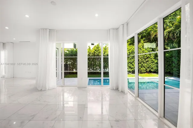 a kitchen with a refrigerator and a sink