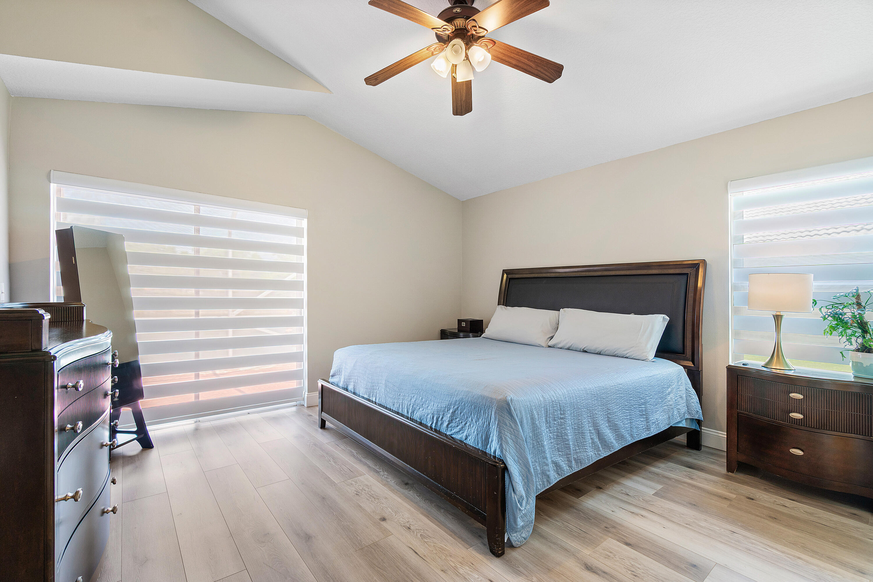 10560 Plainview Circle Boca Raton, FL 33498 - Photo 13 of 45 a bedroom with a bed and ceiling fan