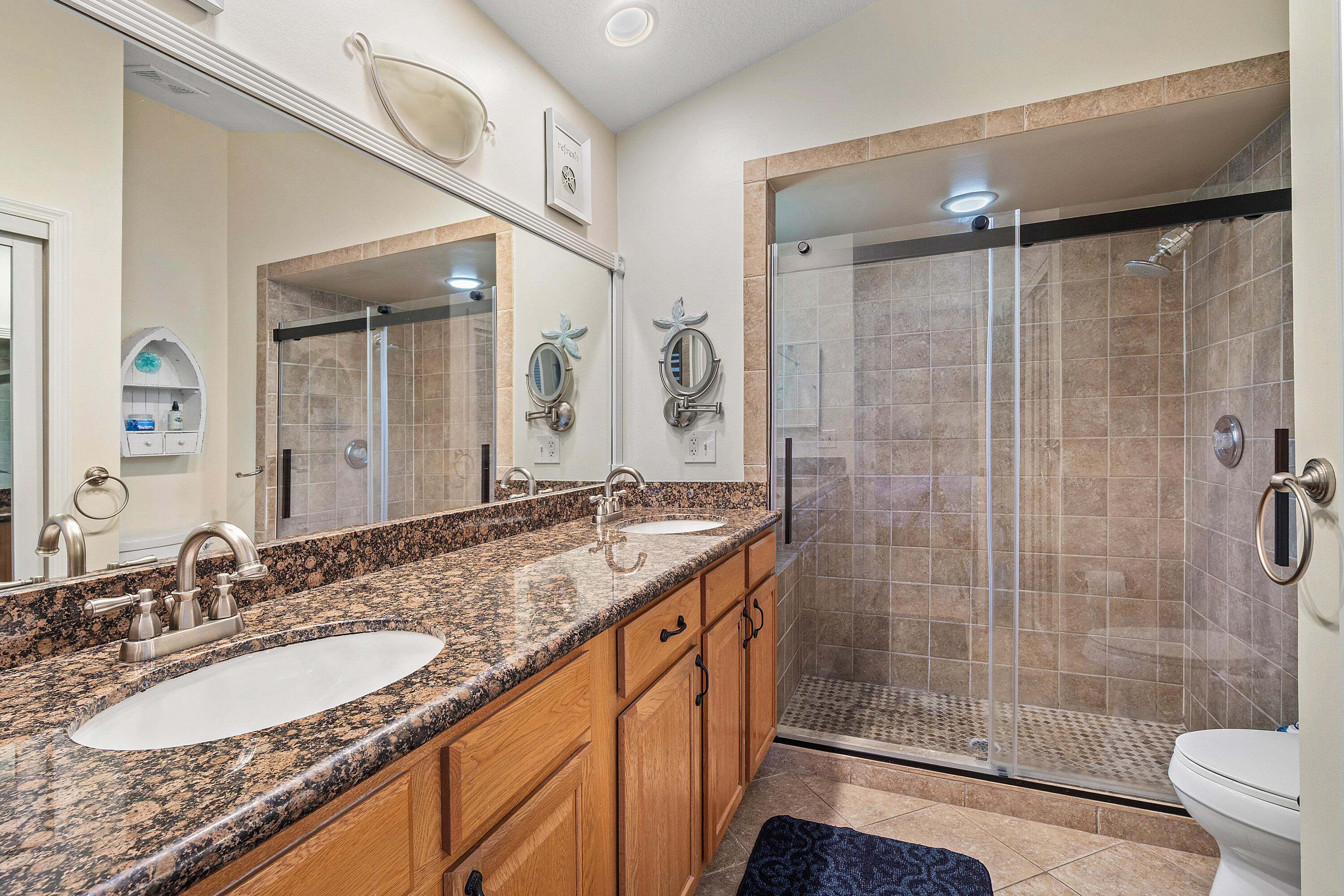 10560 Plainview Circle Boca Raton, FL 33498 - Photo 15 of 45 a bathroom with a granite countertop sink mirror and shower