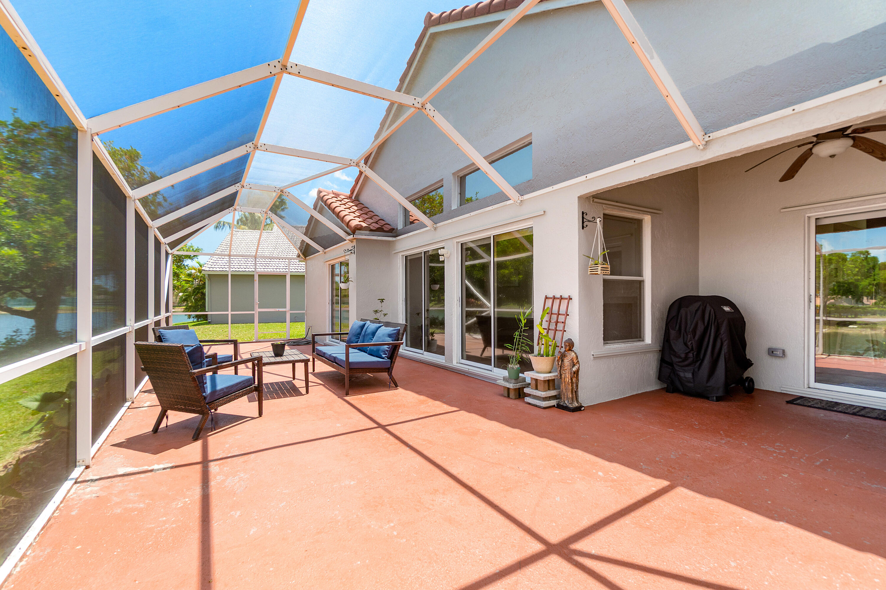 10560 Plainview Circle Boca Raton, FL 33498 - Photo 24 of 45 a view of a chairs and table in a patio