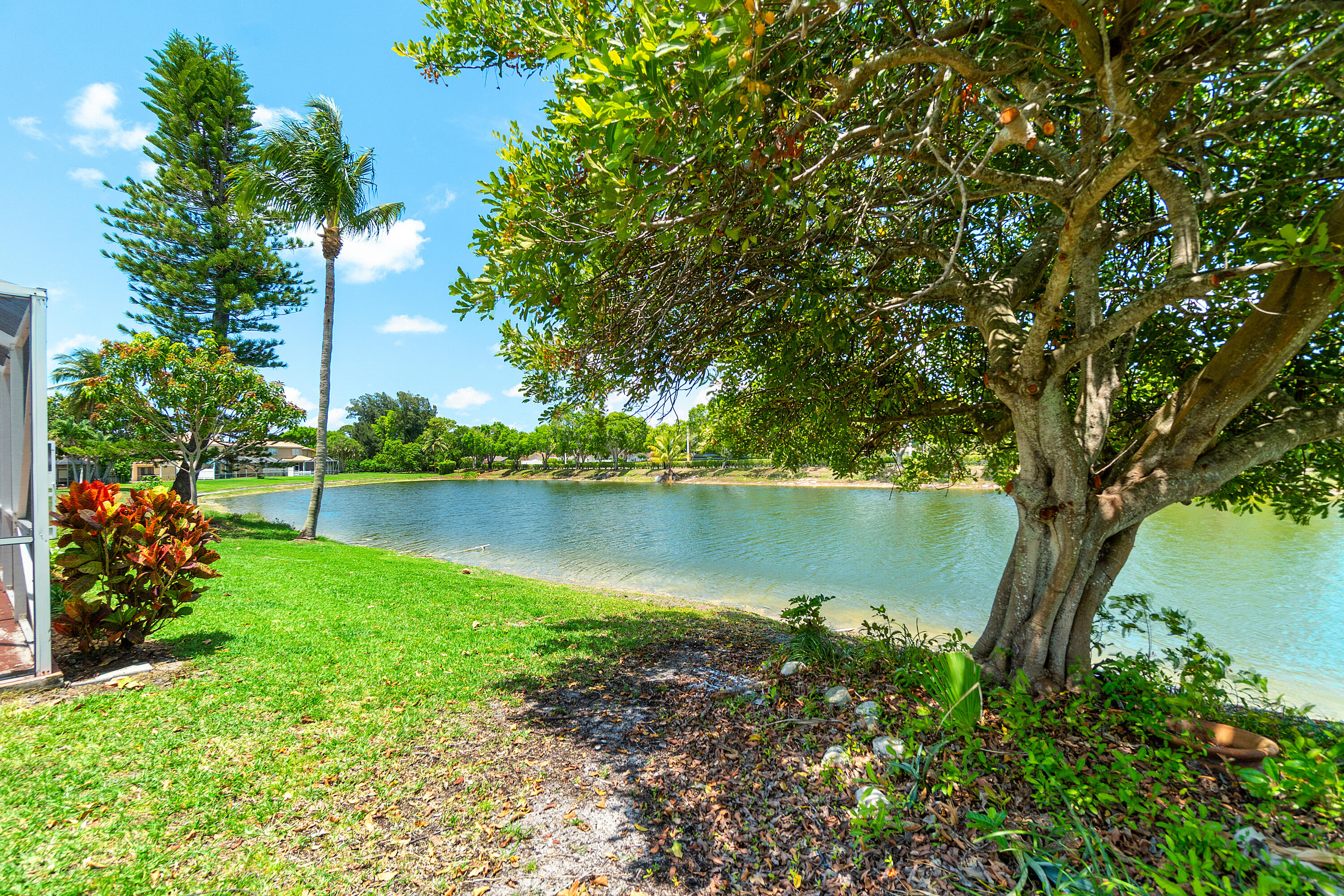 10560 Plainview Circle Boca Raton, FL 33498 - Photo 26 of 45 a view of a garden with a lake