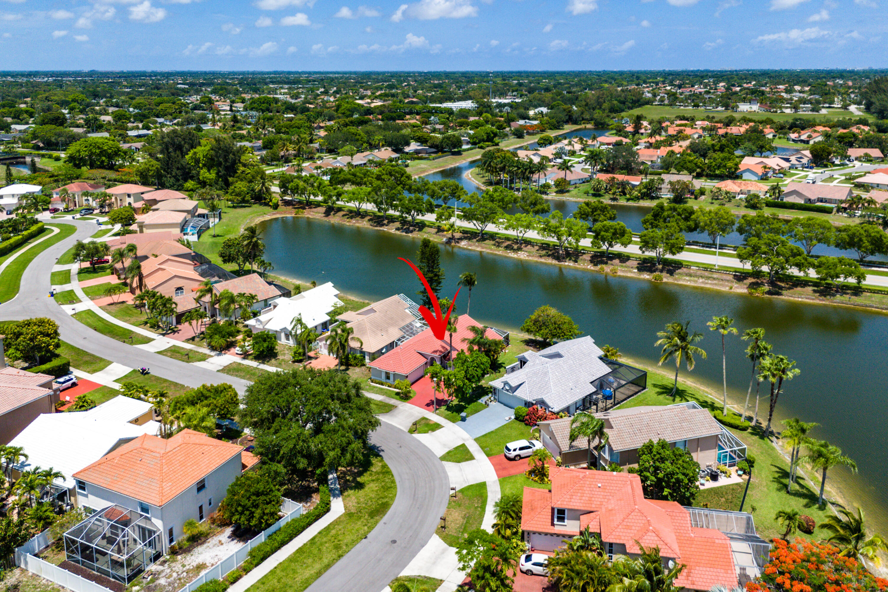 10560 Plainview Circle Boca Raton, FL 33498 - Photo 32 of 45 an aerial view of residential houses with outdoor space and lake view