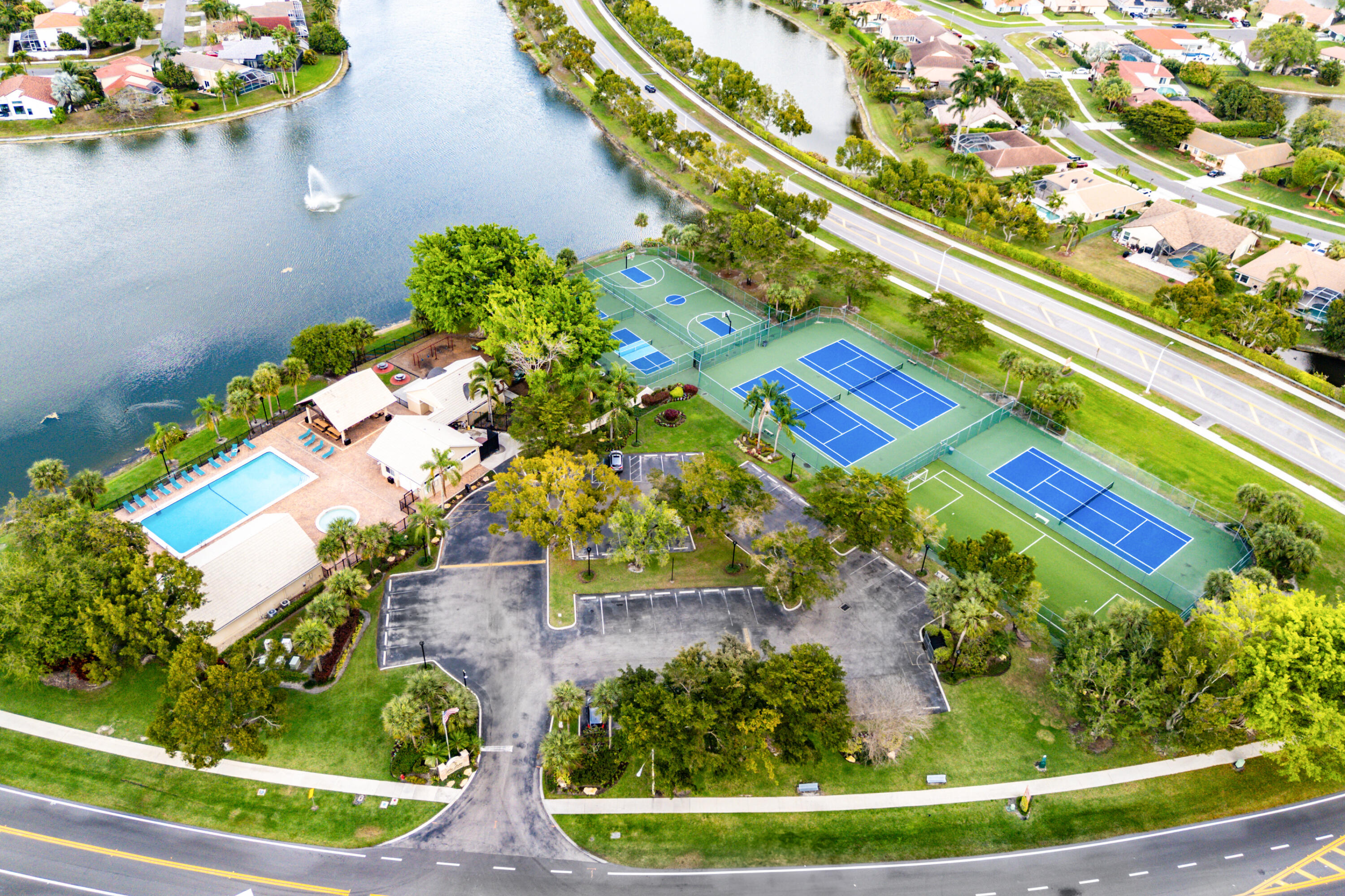 10560 Plainview Circle Boca Raton, FL 33498 - Photo 36 of 45 a view of swimming pool with a yard and plants