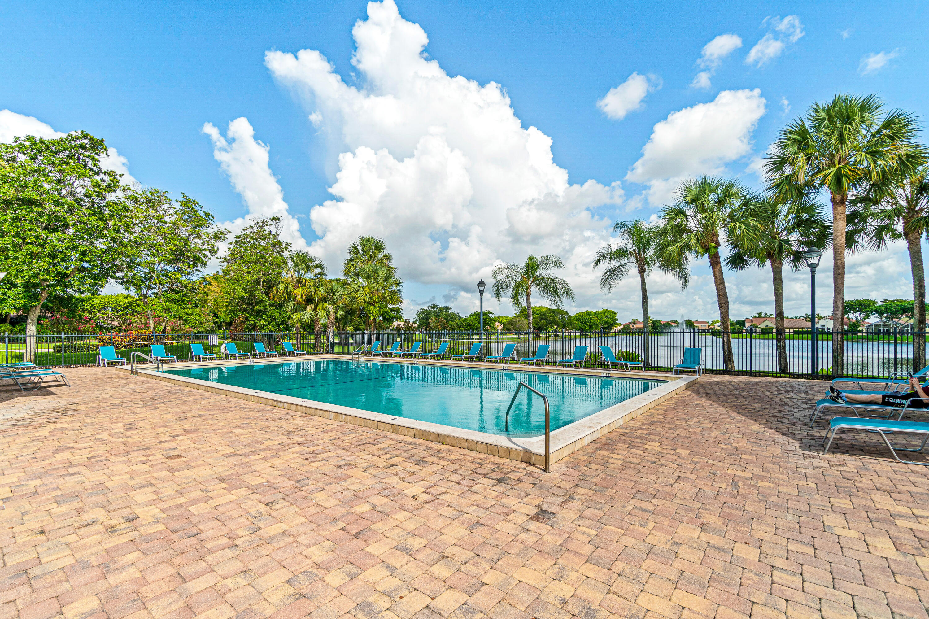 10560 Plainview Circle Boca Raton, FL 33498 - Photo 43 of 45 a view of swimming pool with a yard and palm trees