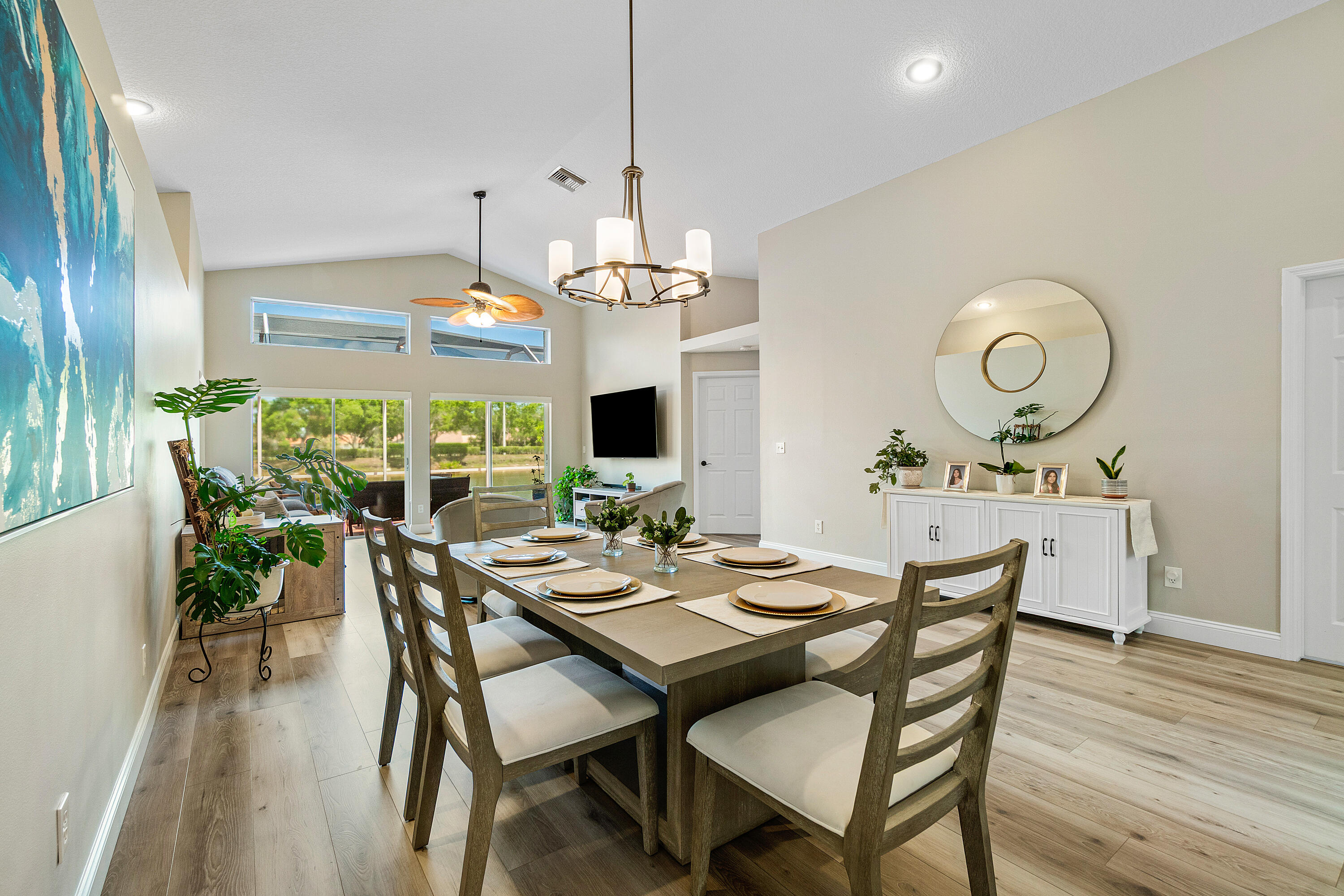 10560 Plainview Circle Boca Raton, FL 33498 - Photo 9 of 45 a view of a dining room with furniture window and wooden floor