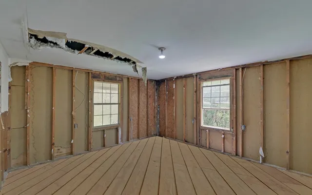 an empty room with windows