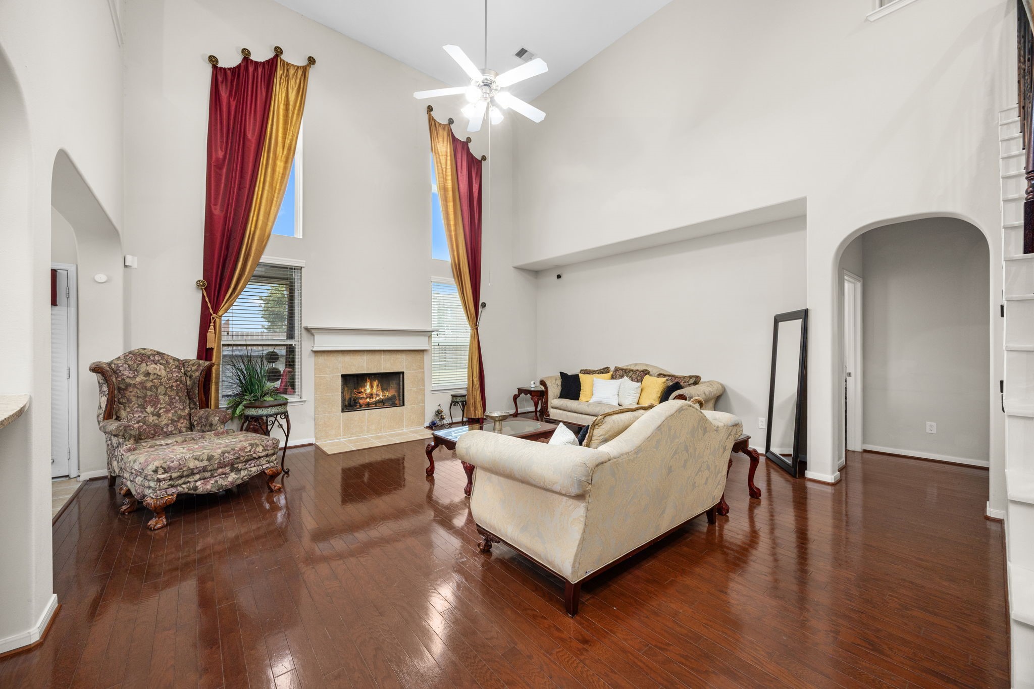 6719 Latchmore Lane Houston, TX 77049 - Photo 7 of 46 a living room with furniture a fireplace and a flat screen tv