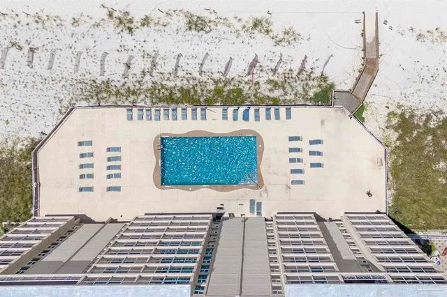 a view of a brick building with many windows