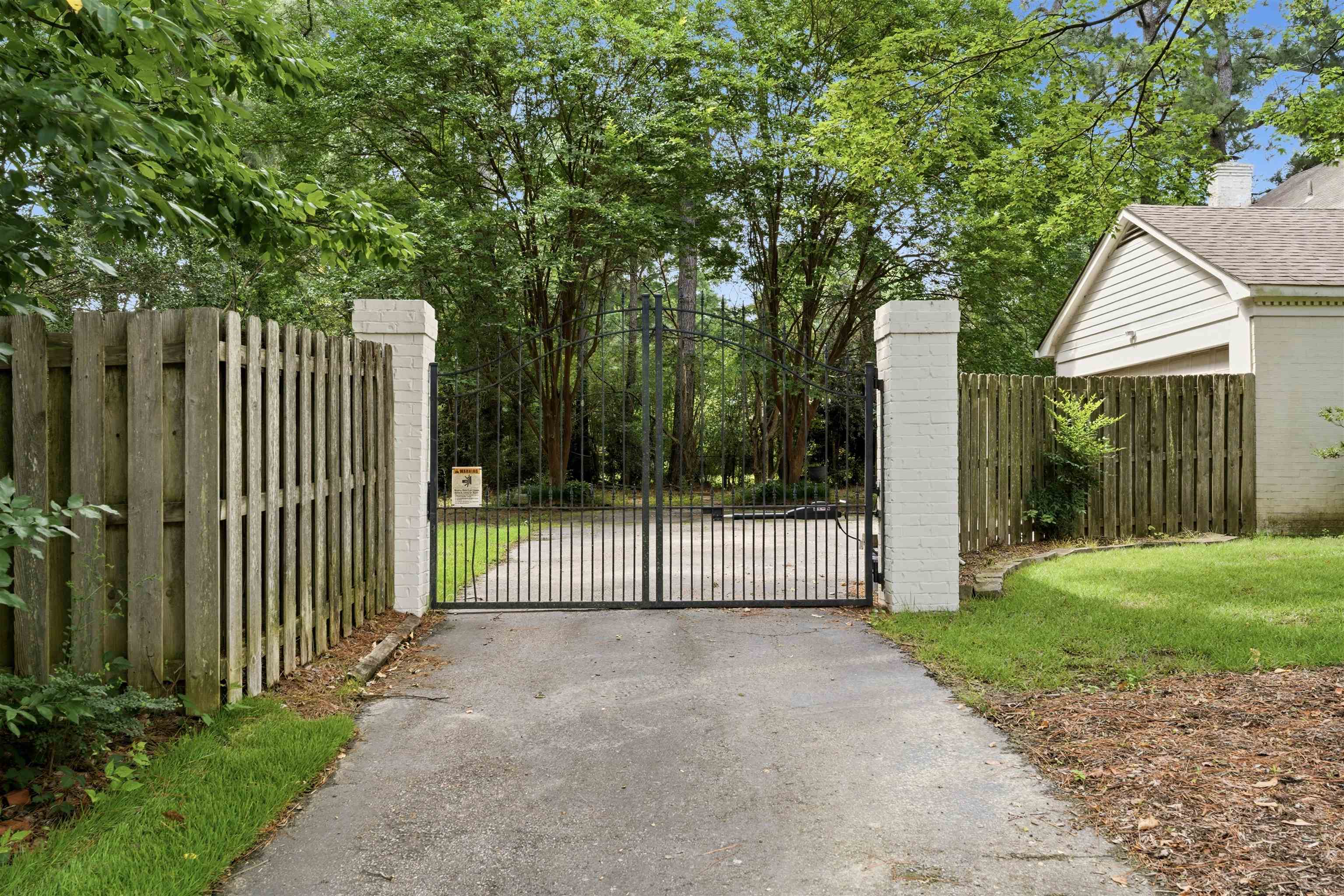1984 Allenby Road Germantown, TN 38139 - Photo 6 of 37 Gated entry with brick columns and wrought iron gates