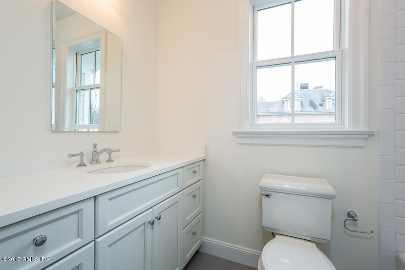 52 Brookside Drive, Unit D Greenwich, CT 06830 - Photo 24 of 24 a bathroom with a toilet sink and window