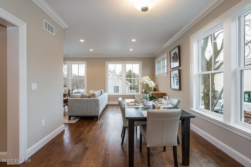 52 Brookside Drive, Unit D Greenwich, CT 06830 - Photo 6 of 24 a view of a dining room with furniture window and wooden floor