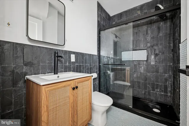 a view of a hallway with wooden floor and stairs