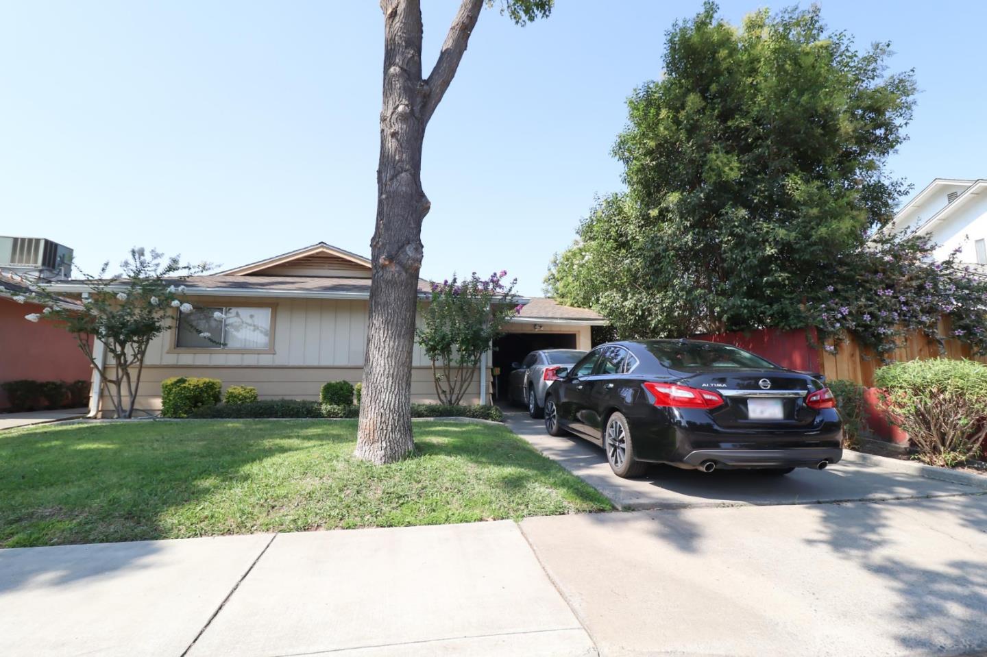1725 East Rumble Road Modesto, CA 95355 - Photo 8 of 31 a view of a car parked in front of a house
