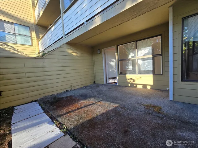 a view of a porch with wooden floor