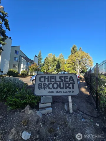 a view of a bench in backyard