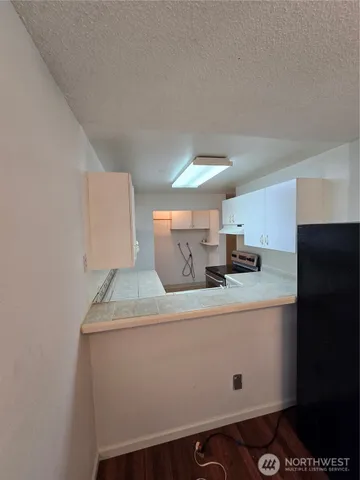 a kitchen with a stove and a refrigerator