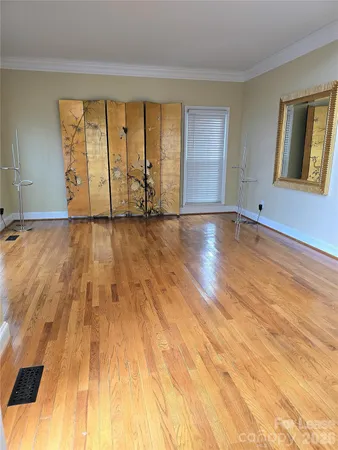 a view of an empty room with windows