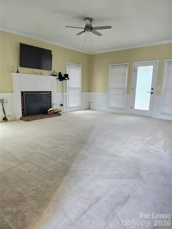 a view of empty room with a fireplace