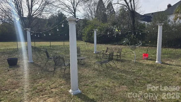 a view of a yard with a tree