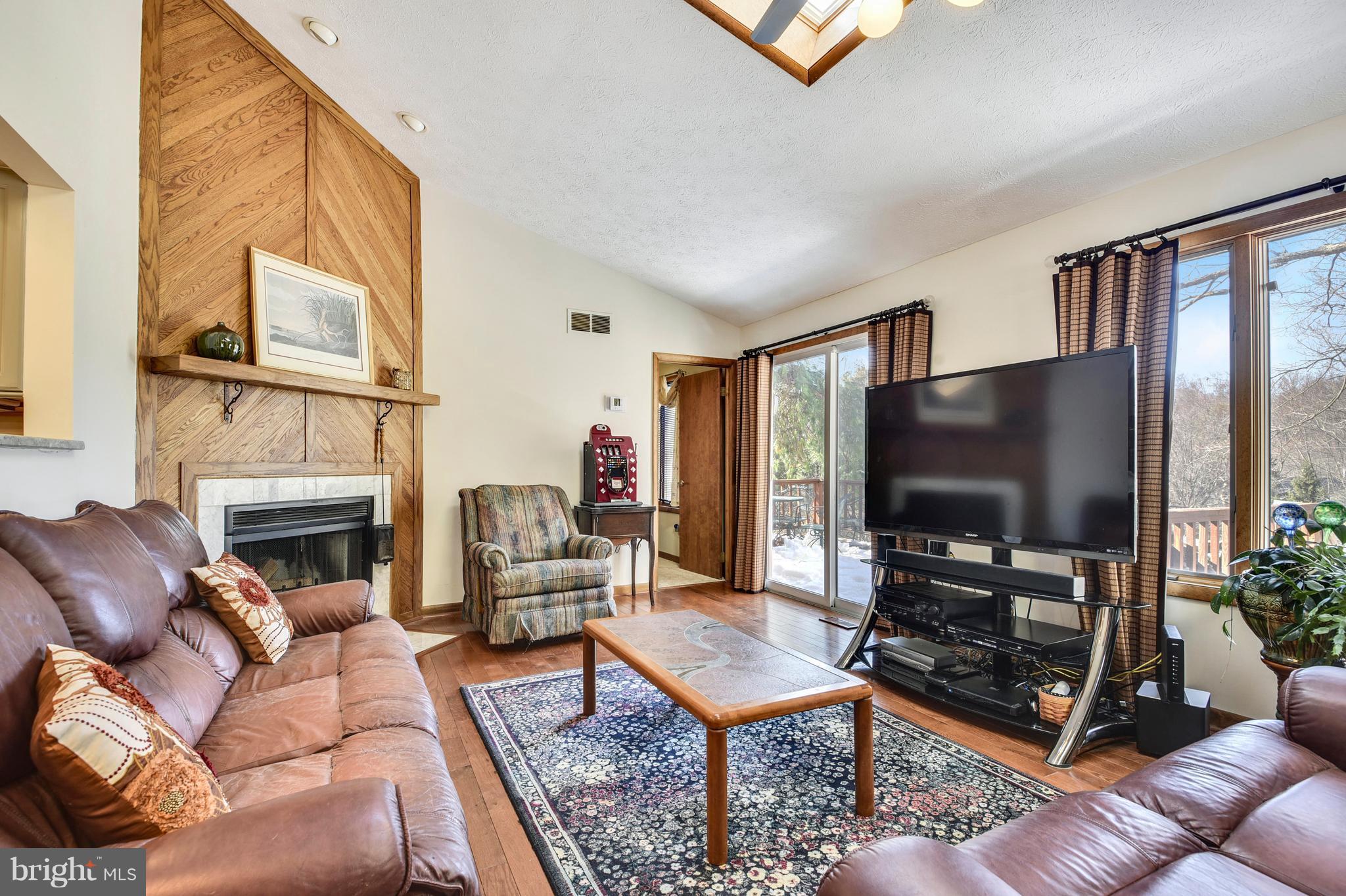 2800 Anderson Road White Hall, MD 21161 - Photo 14 of 30 Family Room with wood fireplace and sliding door