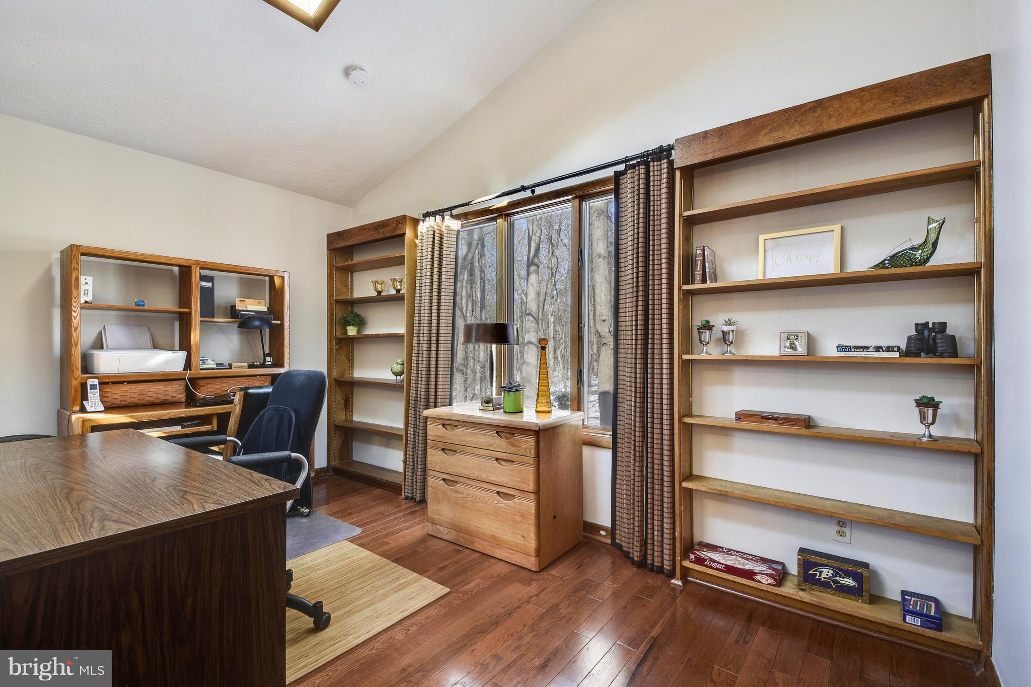 2800 Anderson Road White Hall, MD 21161 - Photo 15 of 30 Built in bookcases with view of wooded side yard