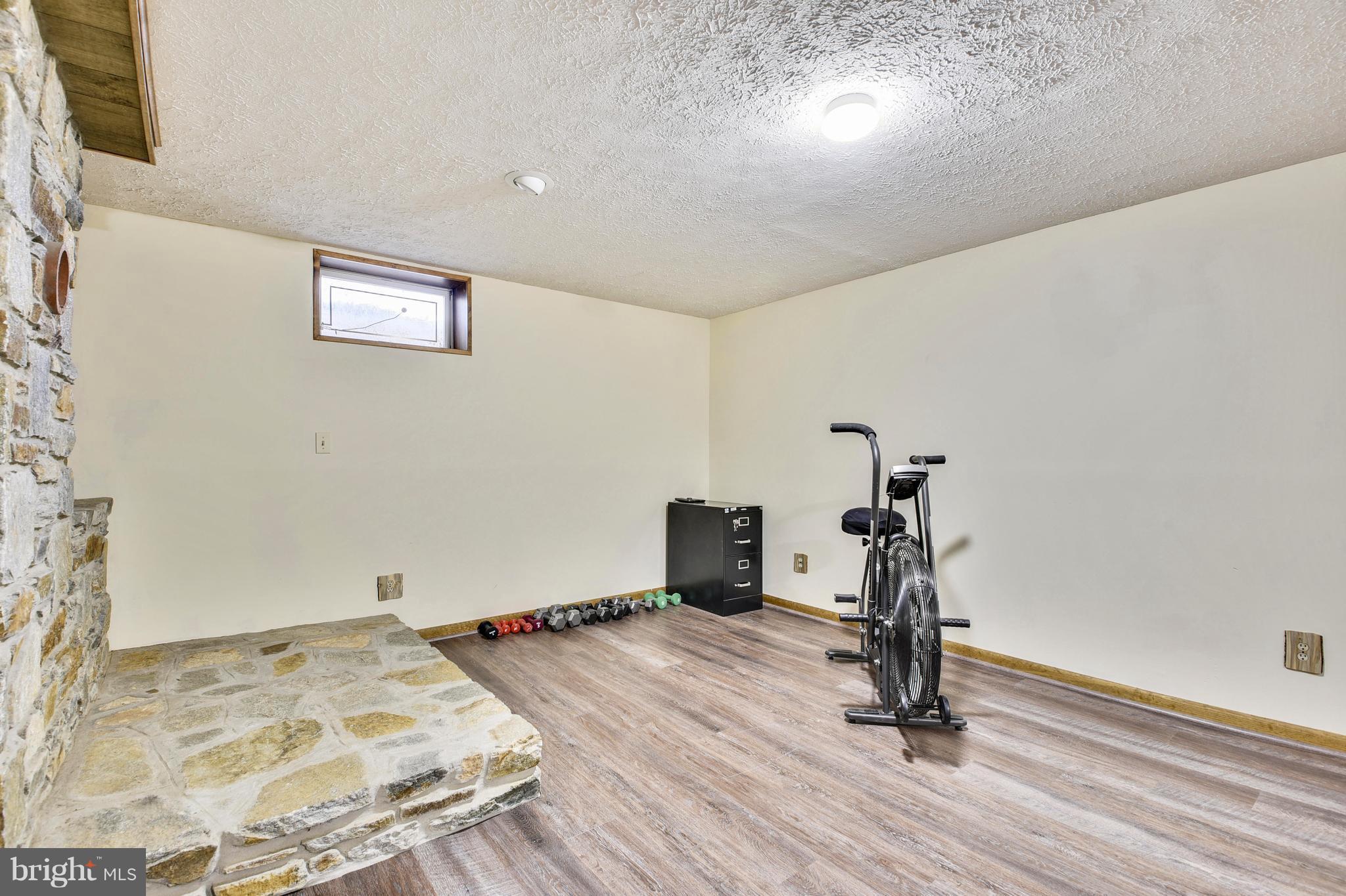 2800 Anderson Road White Hall, MD 21161 - Photo 25 of 30 Recreation room w/ new floor and wood stove flue