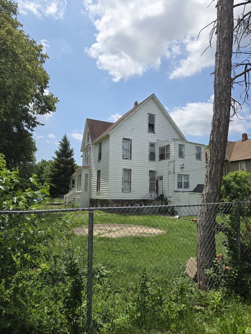 738 West 87th Street Chicago, IL 60620 - Photo 2 of 3 a view of a house with a yard