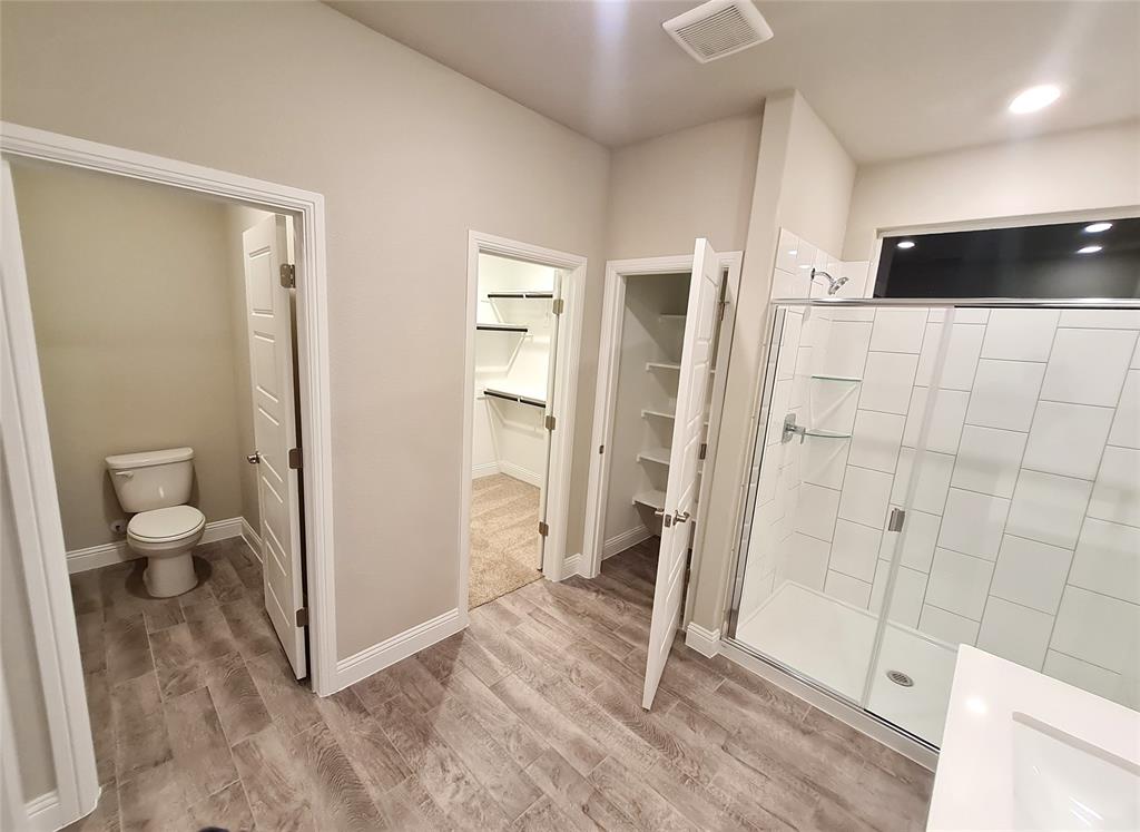 1604 Buzzard Road Denton, TX 76205 - Photo 11 of 22 Another view of Master Bath with toilet and master walk-in-closet.