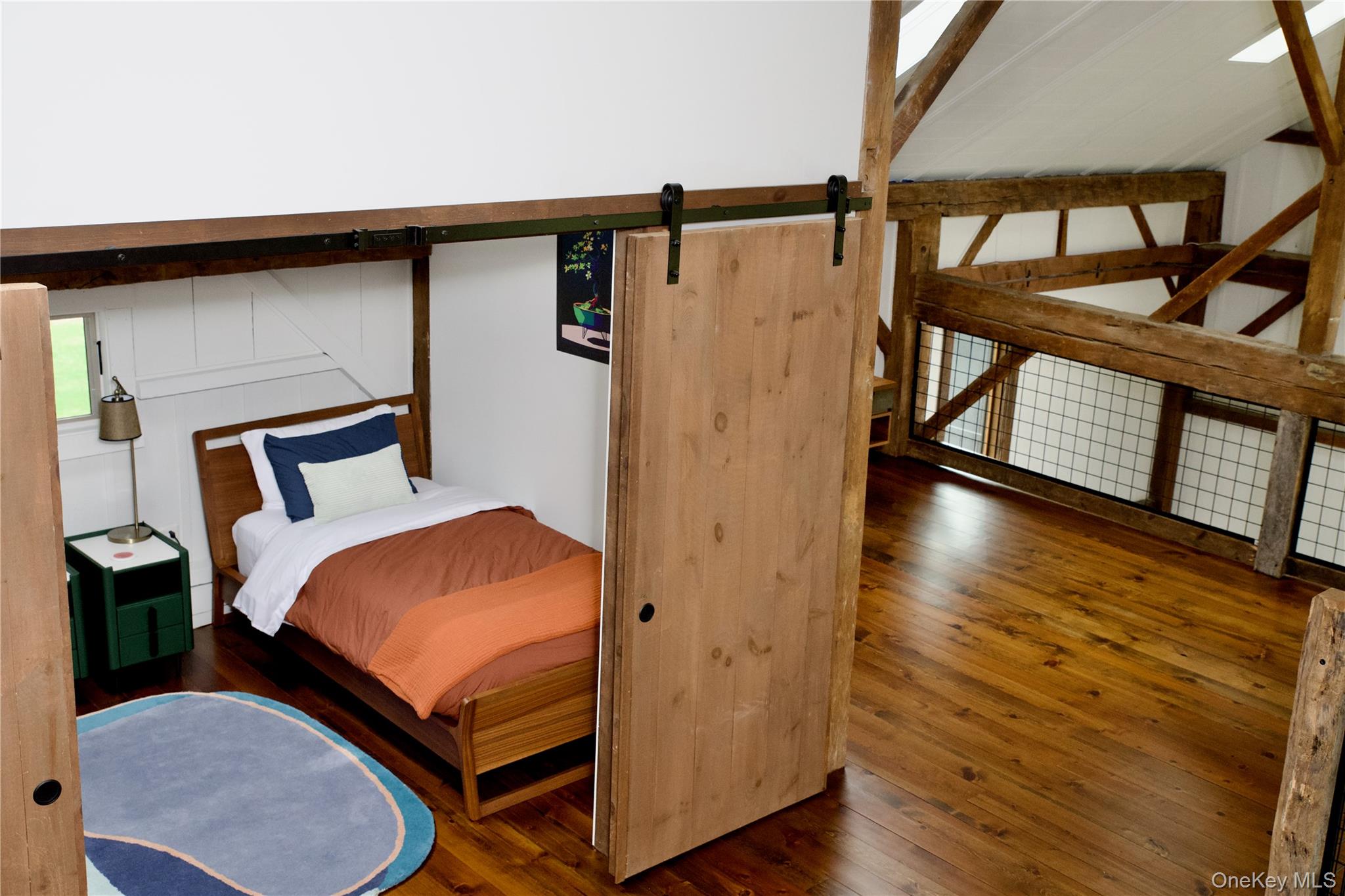 107 Cold Spring Road Stanfordville, NY 12581 - Photo 27 of 36 a bedroom with bed and wooden floor
