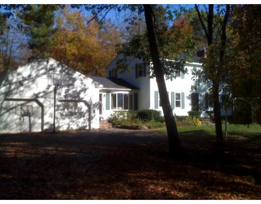 1 Scribner Road Tyngsborough, MA 01879 - Photo 1 of 13 a front view of a house with a yard