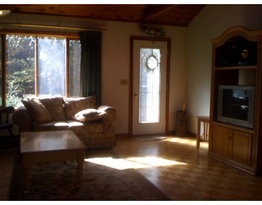 1 Scribner Road Tyngsborough, MA 01879 - Photo 3 of 13 a living room with furniture and a floor to ceiling window