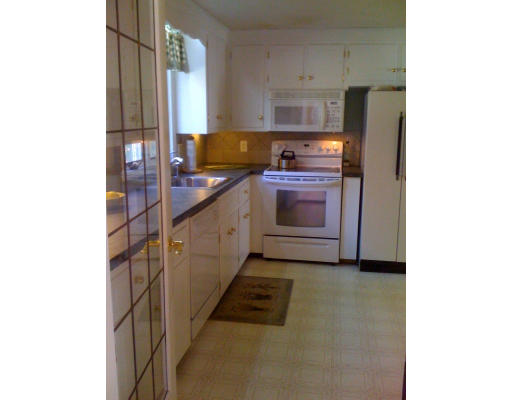1 Scribner Road Tyngsborough, MA 01879 - Photo 5 of 13 a kitchen with stainless steel appliances a stove and more cabinets