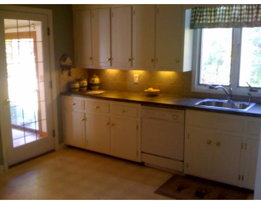 1 Scribner Road Tyngsborough, MA 01879 - Photo 6 of 13 a room with cabinets and window