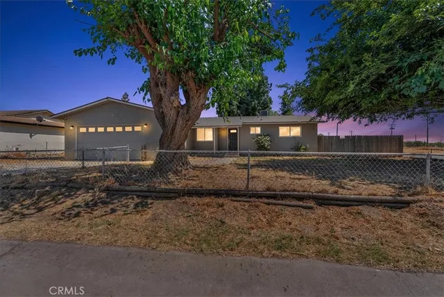 a house view with a garden space