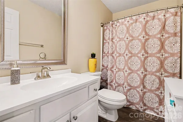 a view of a house with backyard and porch