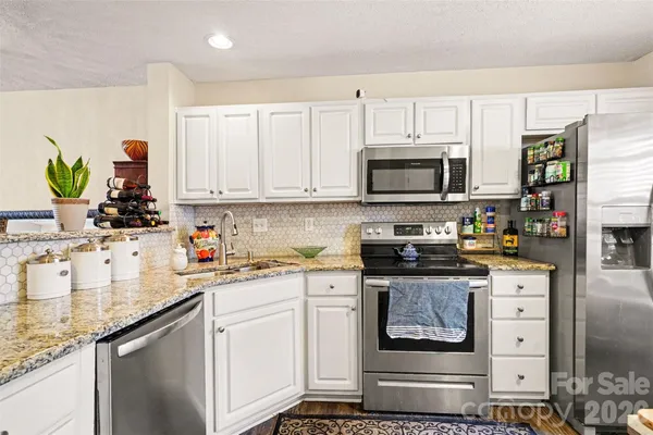 a bathroom with a sink a mirror and a shower