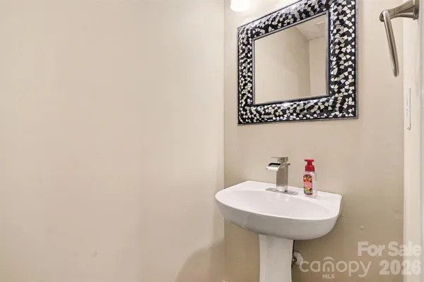 a dining room with furniture a chandelier and window