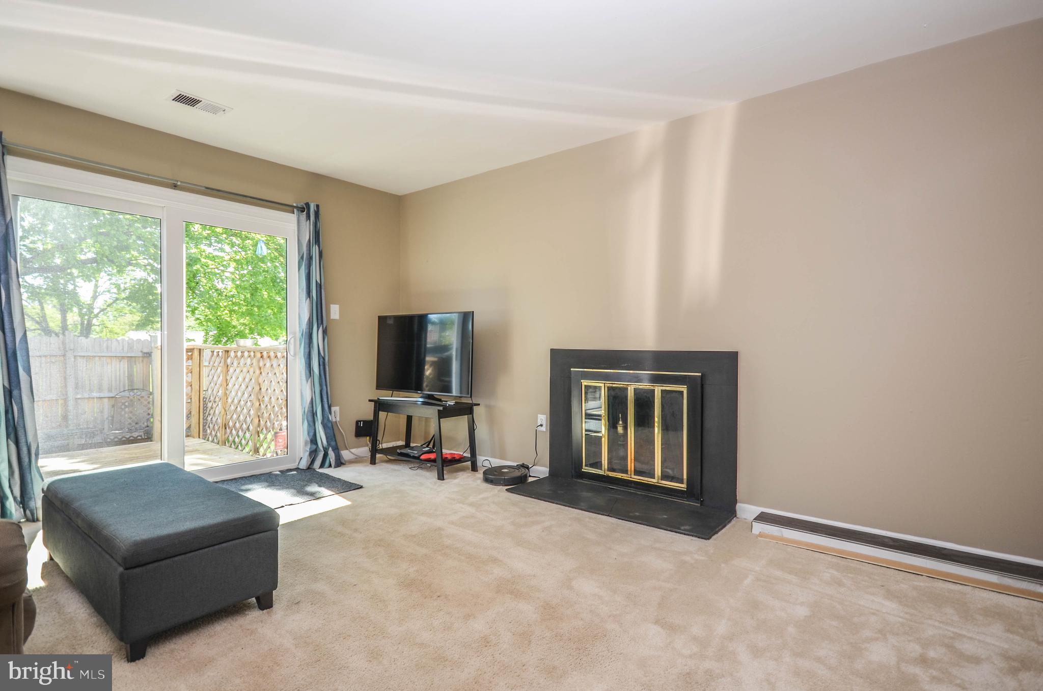17501 Hoskinson Road Poolesville, MD 20837 - Photo 4 of 47 Living room with cozy wood burning fireplace