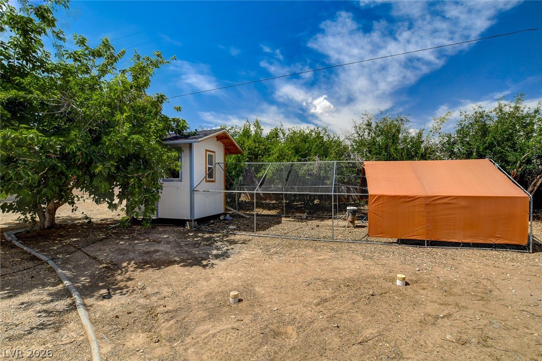 4362 Thistle Street Logandale, NV 89021 - Photo 90 of 99 Cultivate your own eggs and poultry with a dedicated chicken coop and run.