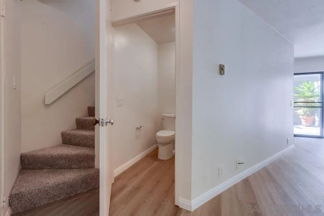 a bathroom with a granite countertop sink